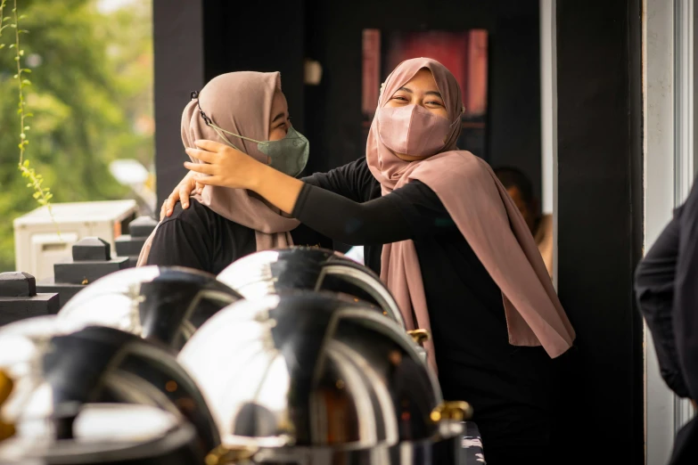 a man and woman in head coverings getting ready to cook