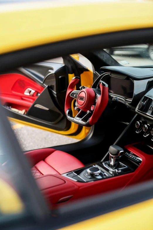 the interior of a sports car, seen from the driver's perspective