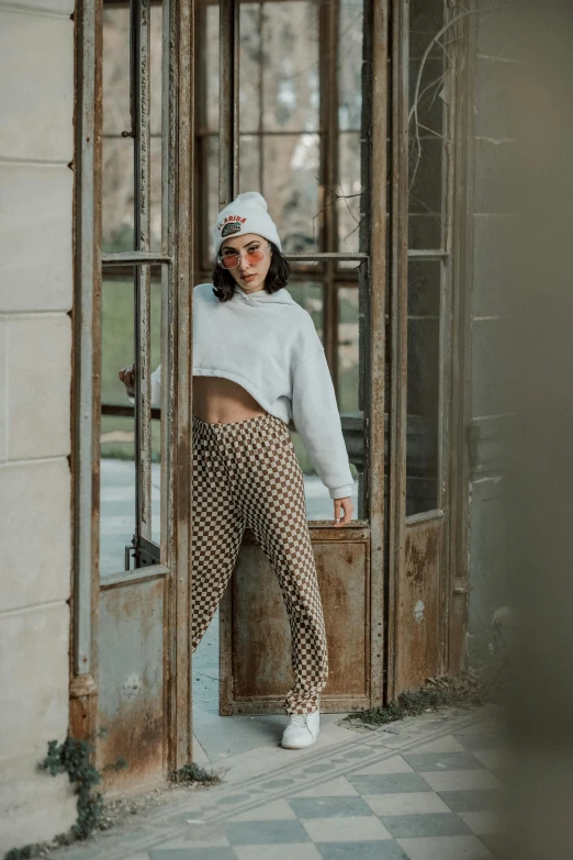 a person standing inside of a wooden door