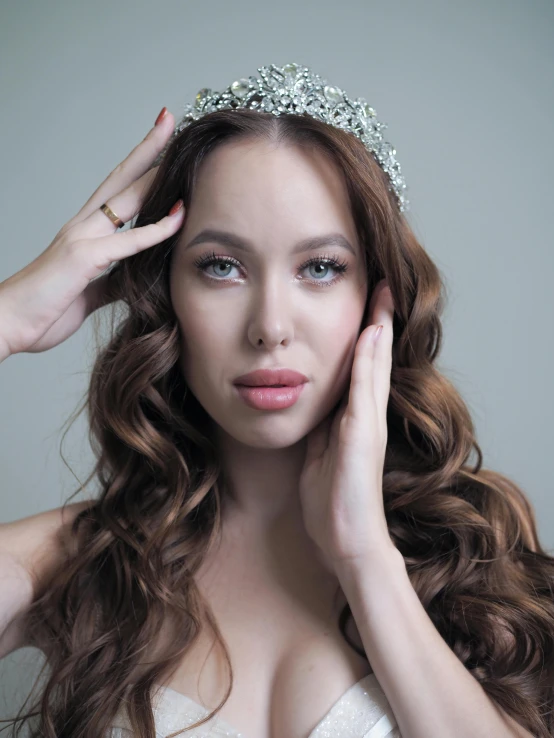 young beautiful woman with tiara on her head