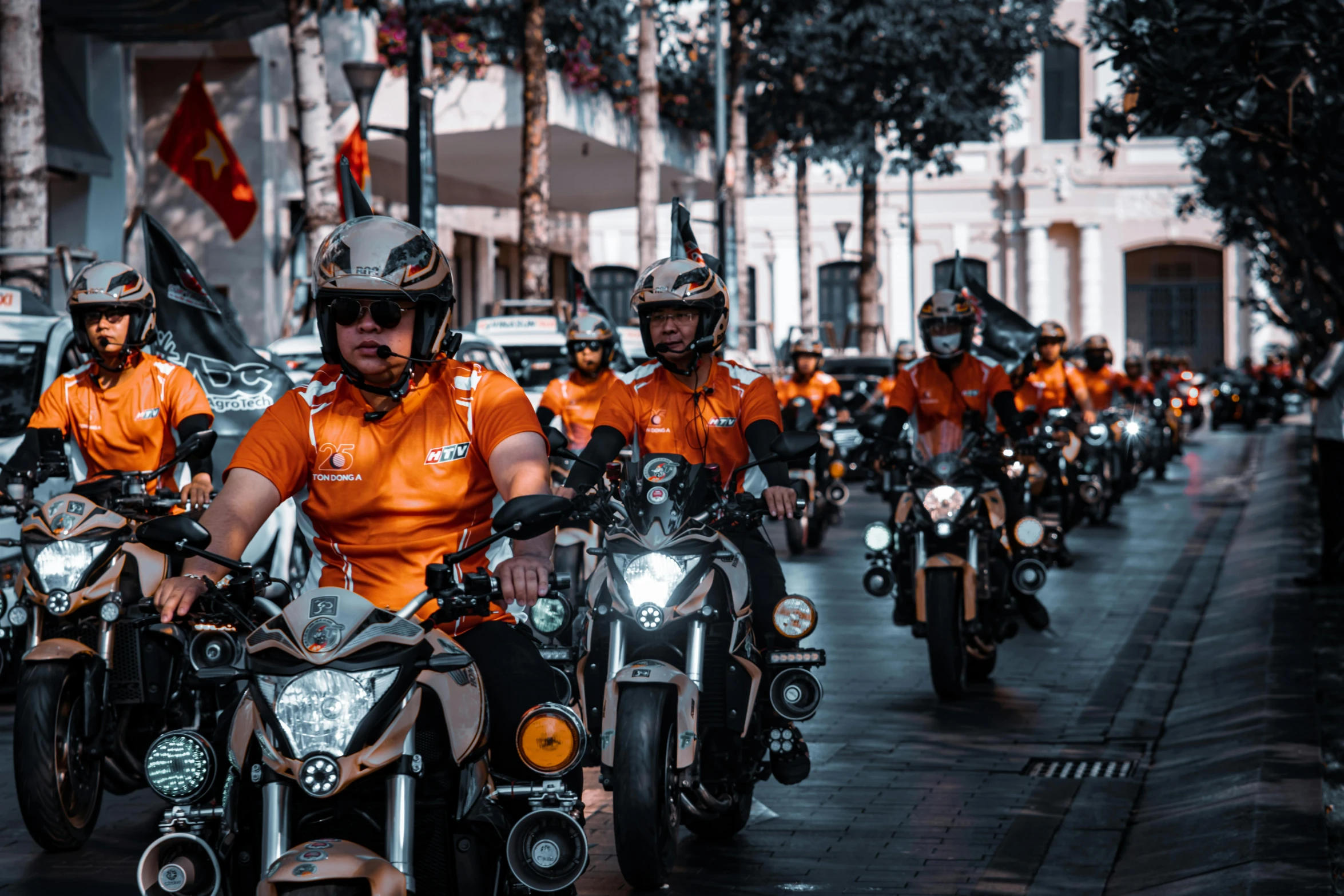 a large group of people on motorcycles in a parade