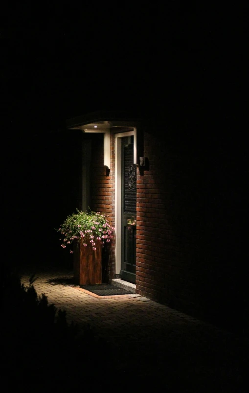 a house door lit up with the lights on at night