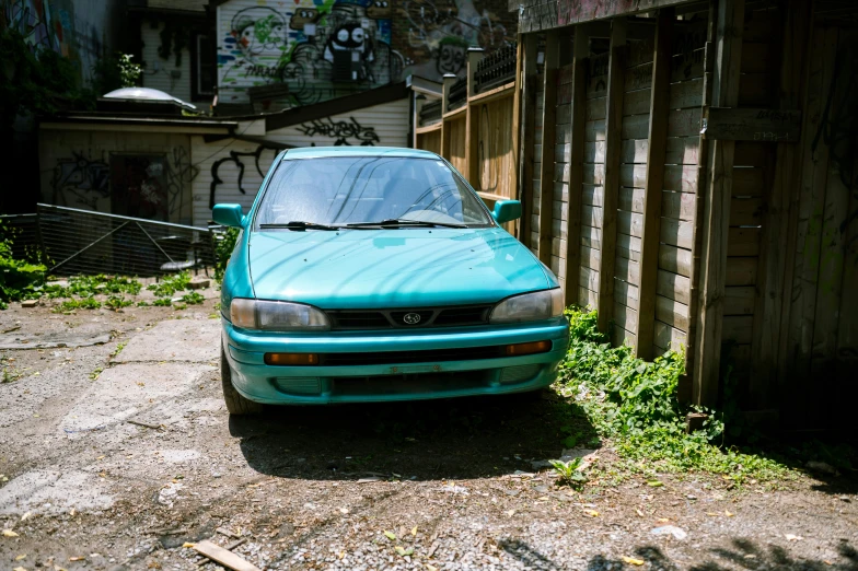 a car parked in front of a gated area