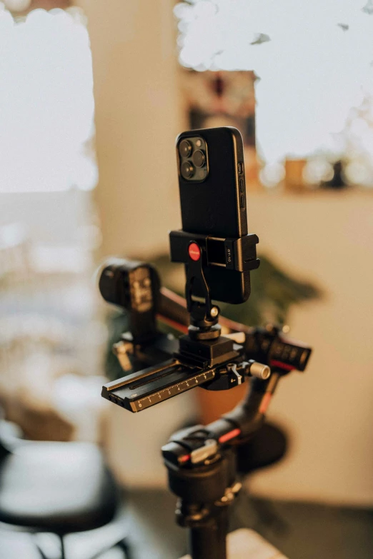 a camera and tripod attached to a camera