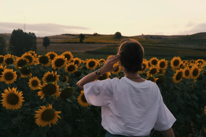 there is a man that is in front of some flowers