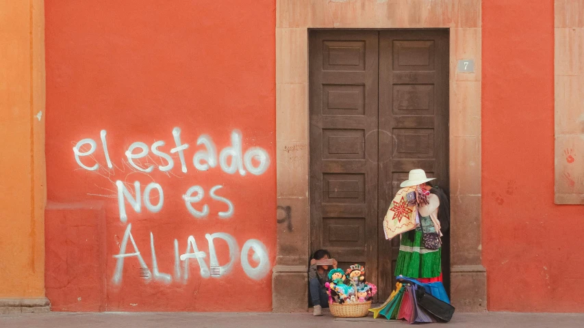 a man with luggage standing by the door