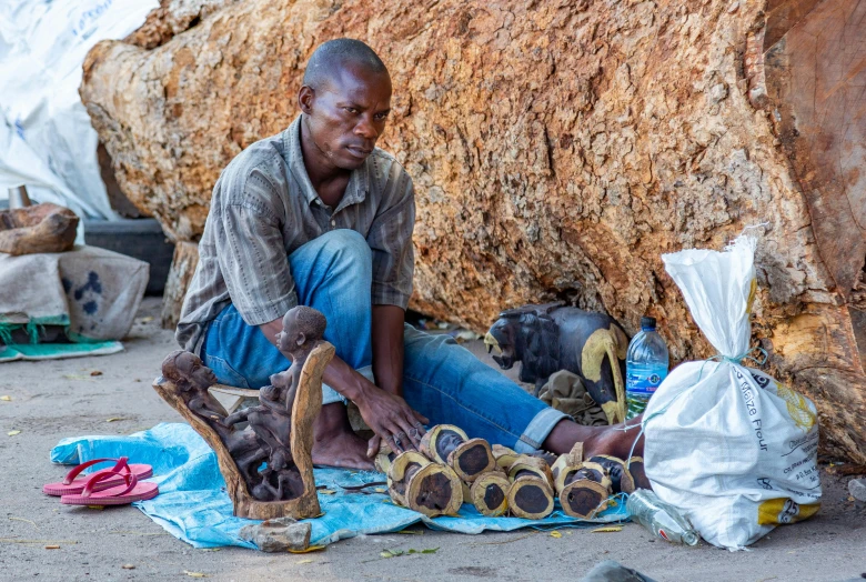 a man is selling items that are being displayed