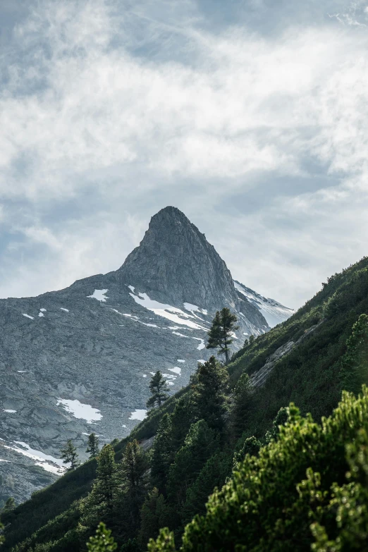 an image of a mountain peak in the middle of winter