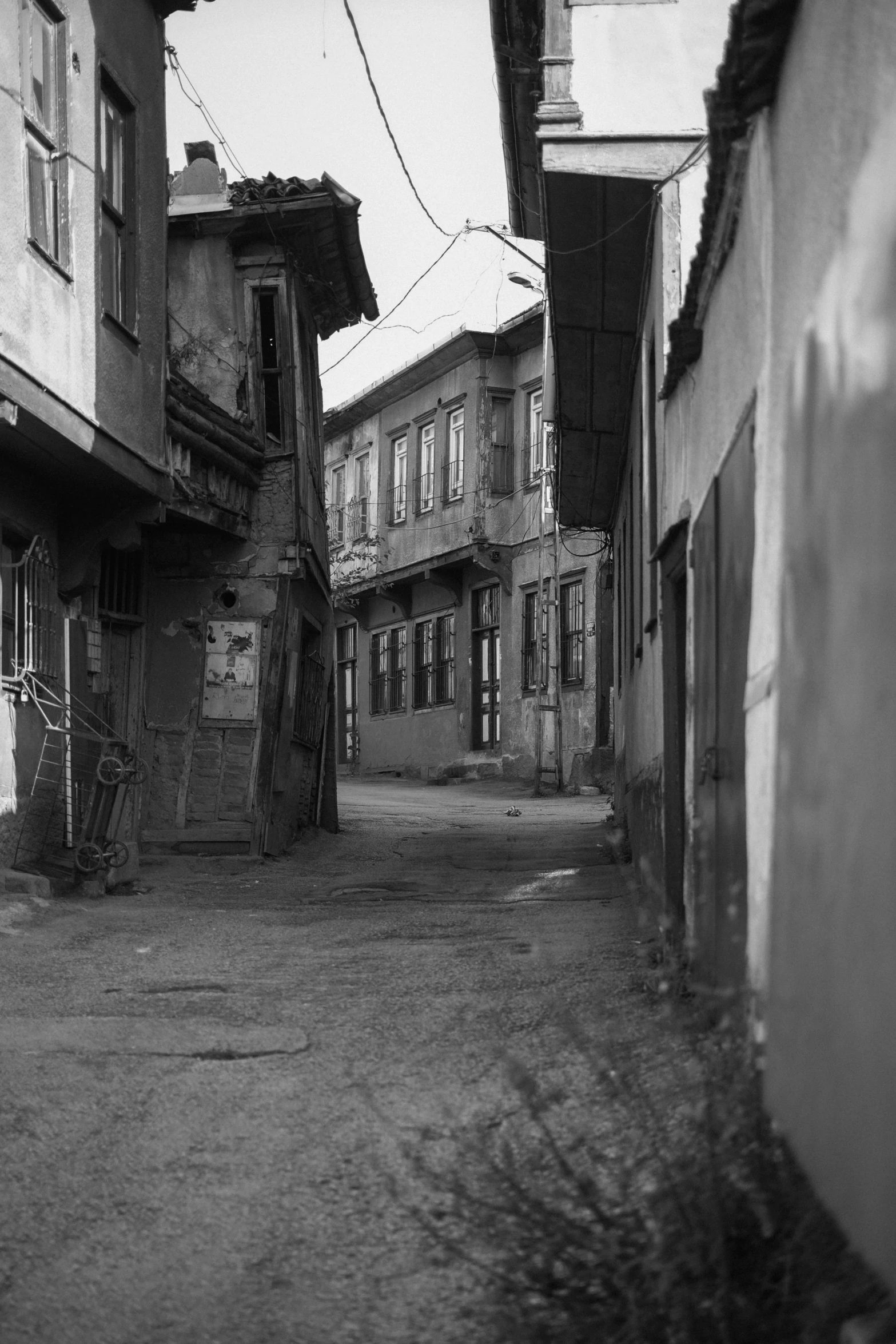 an old city street with abandoned buildings on both sides