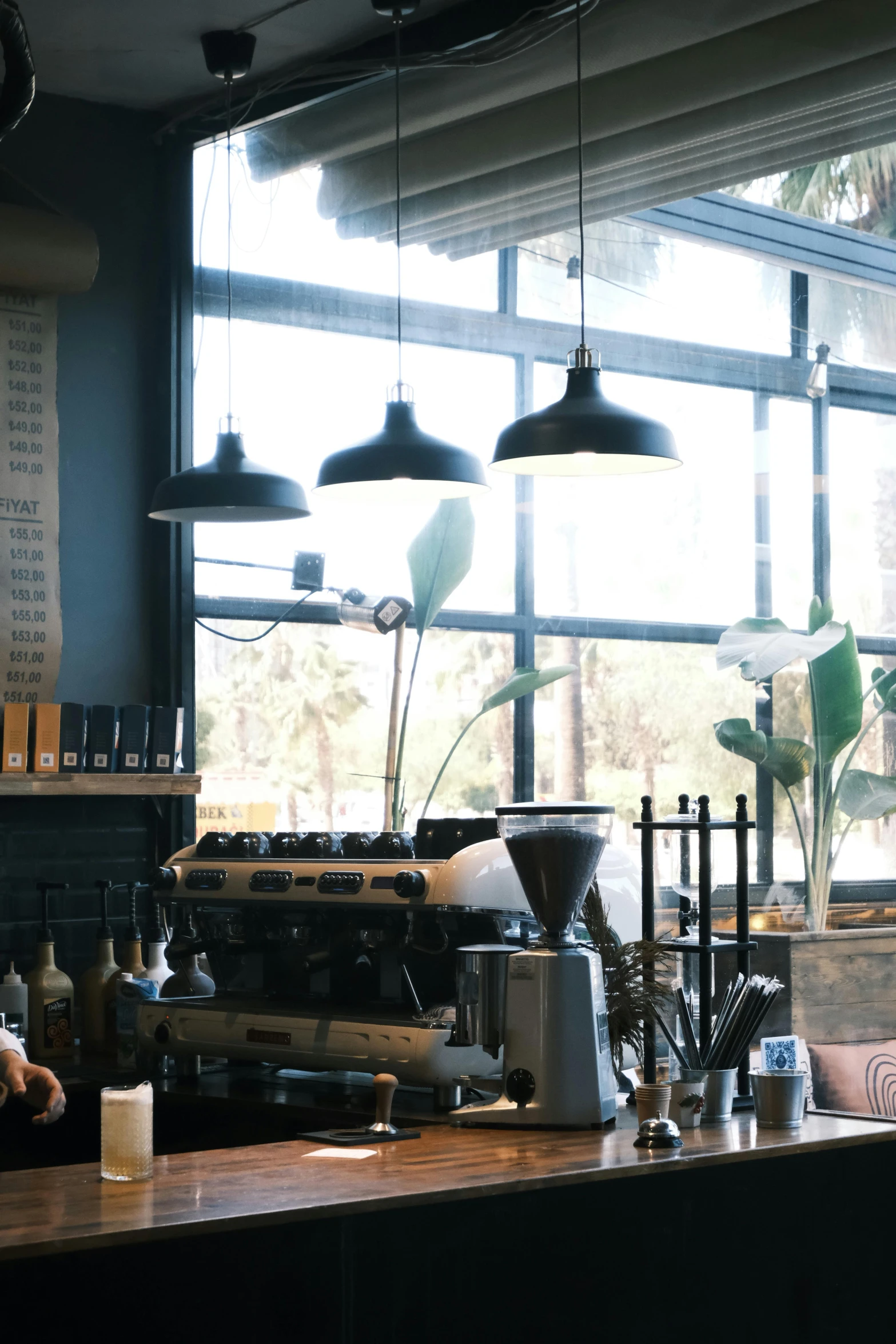 a coffee shop with lots of lights in the windows