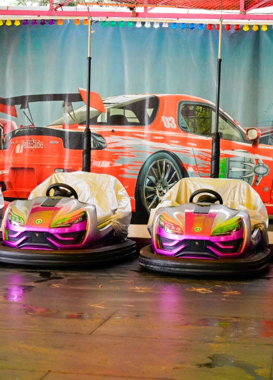 three bumper cars are shown in front of an image