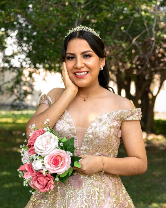 a woman in a dress holding a bouquet of flowers