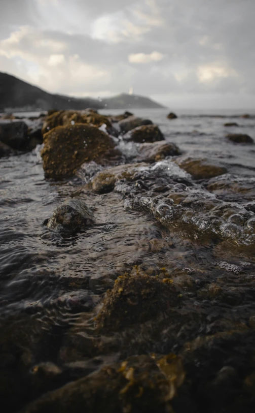 a group of rocks with water over them