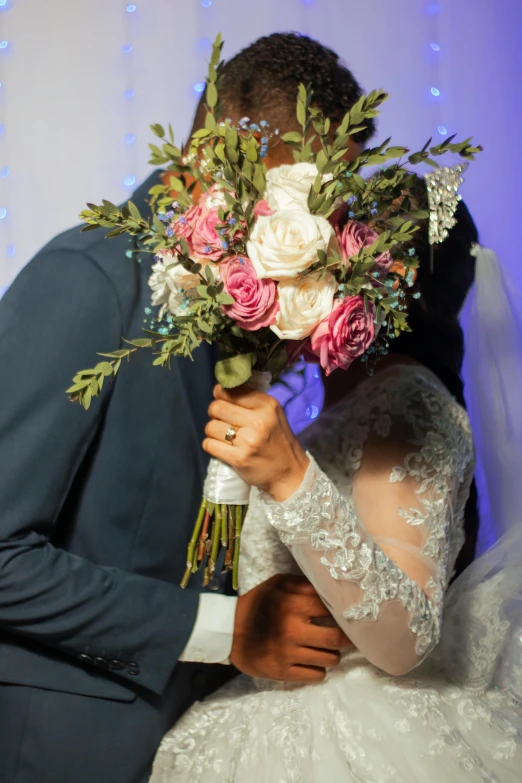 a bride and groom kissing at their wedding