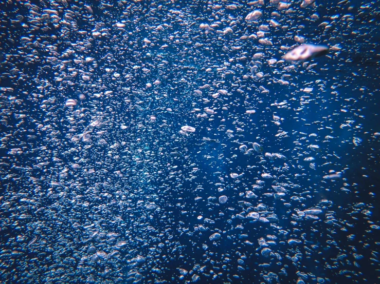 bubbles on the water in a bright blue sky