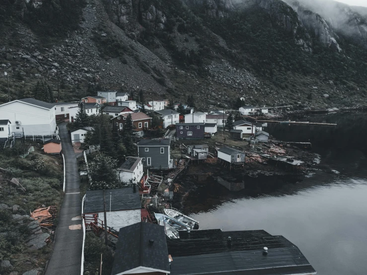 a scenic view of a large river and houses