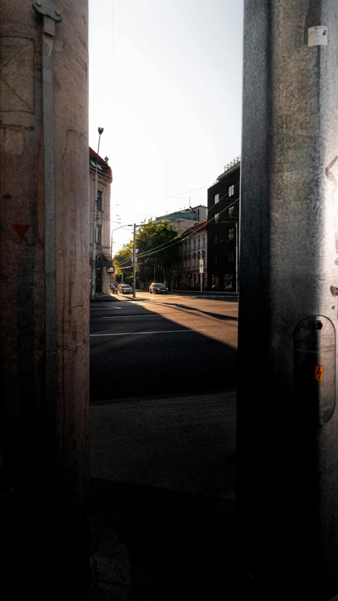 a view of a deserted street as it looks through an open door