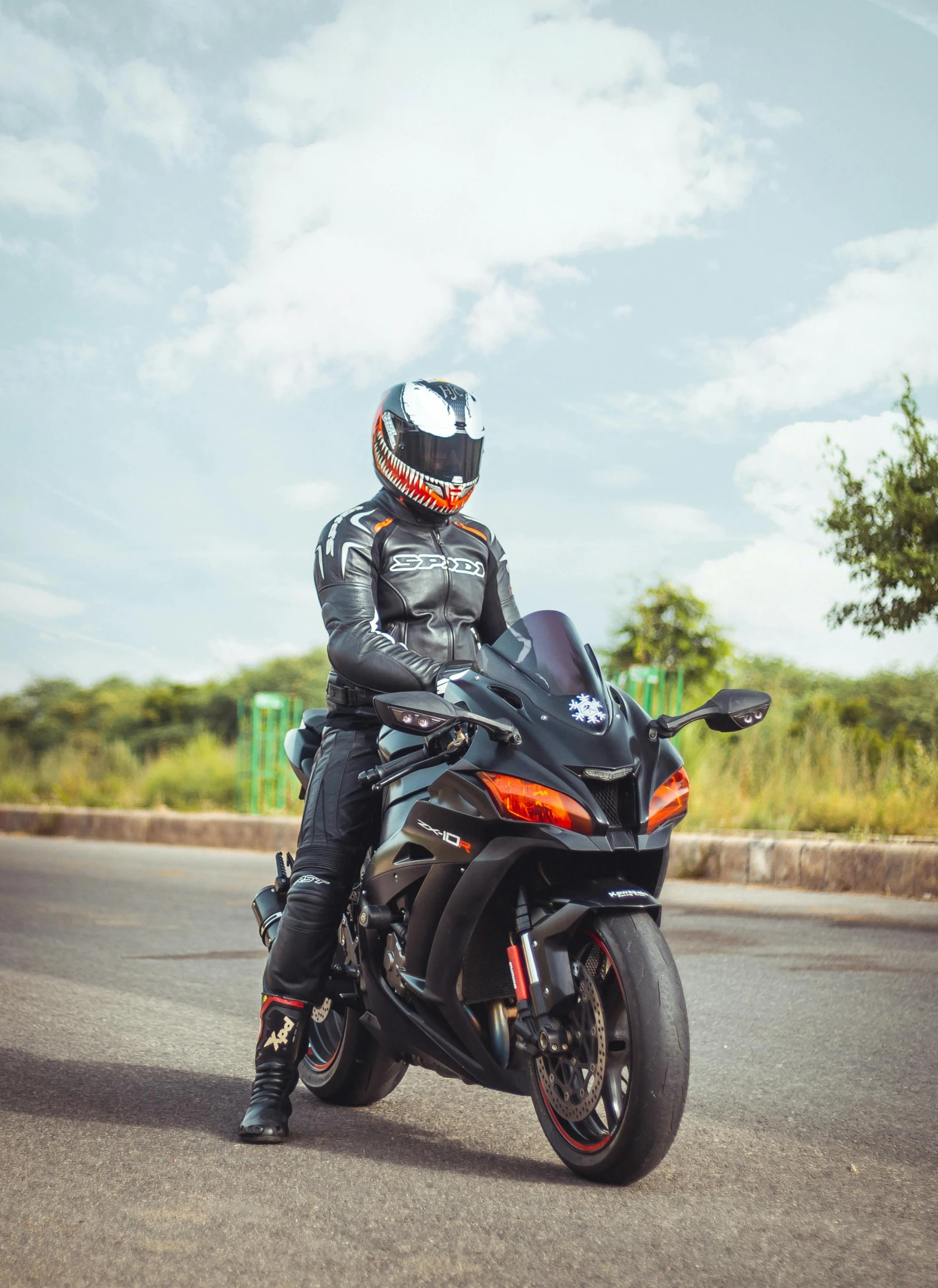 the man is riding his motorcycle on the road