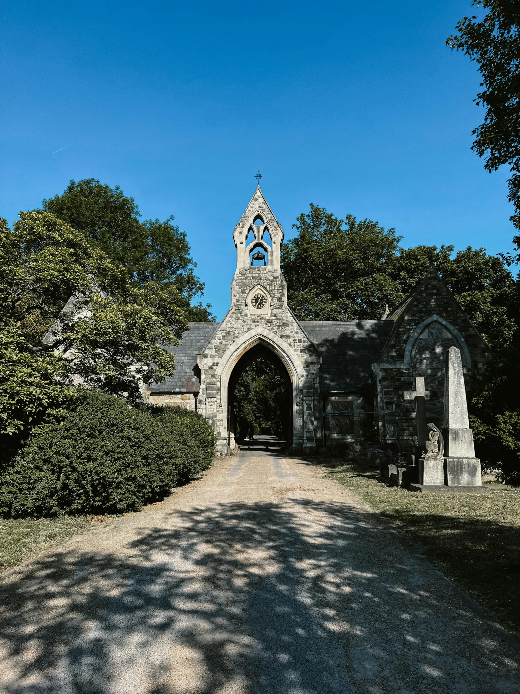 an old building with a stone tower with a clock on it