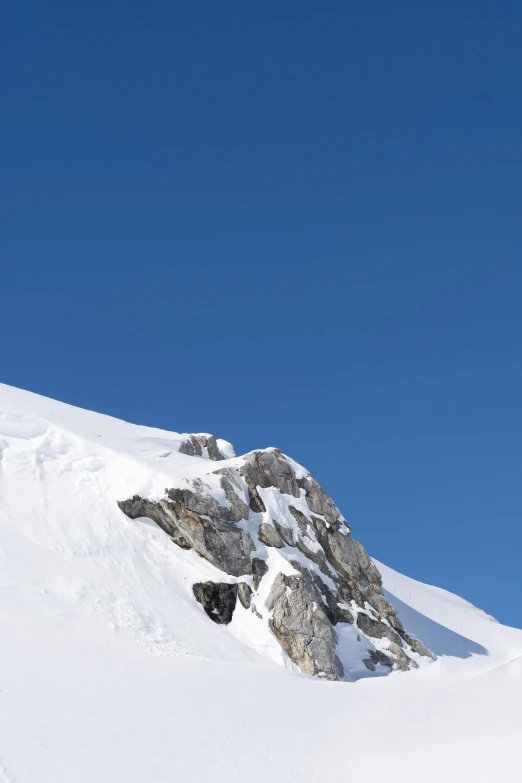 there is a man that is skiing in the snow