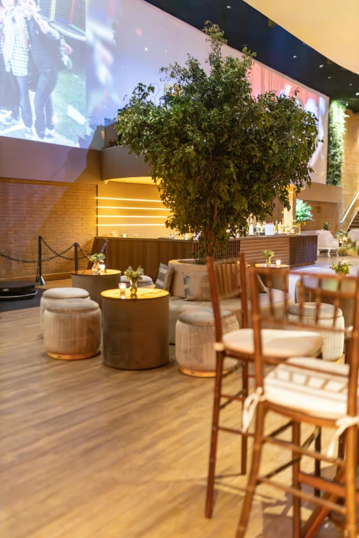 an indoor seating area with chairs and tables