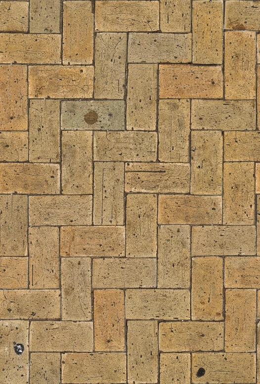 a picture of the corner of a woven brick floor