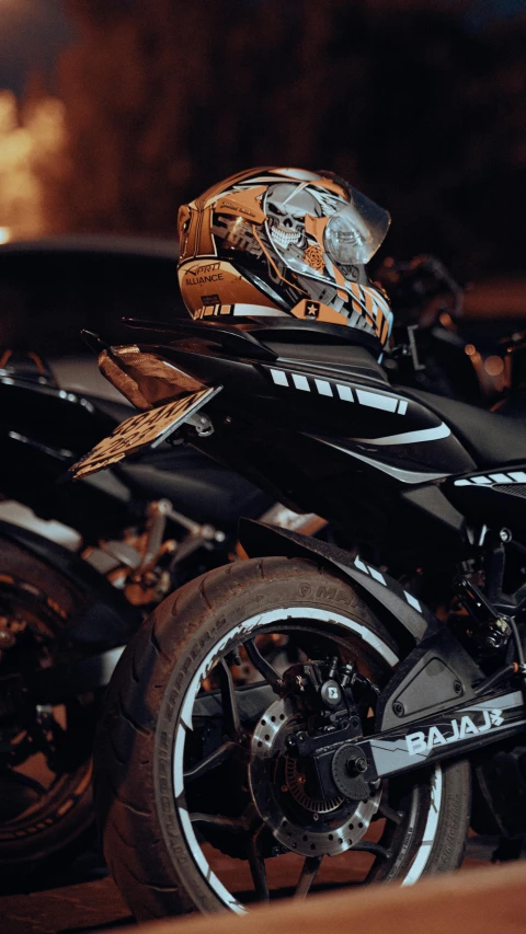 an orange and black motorcycle with its hood up