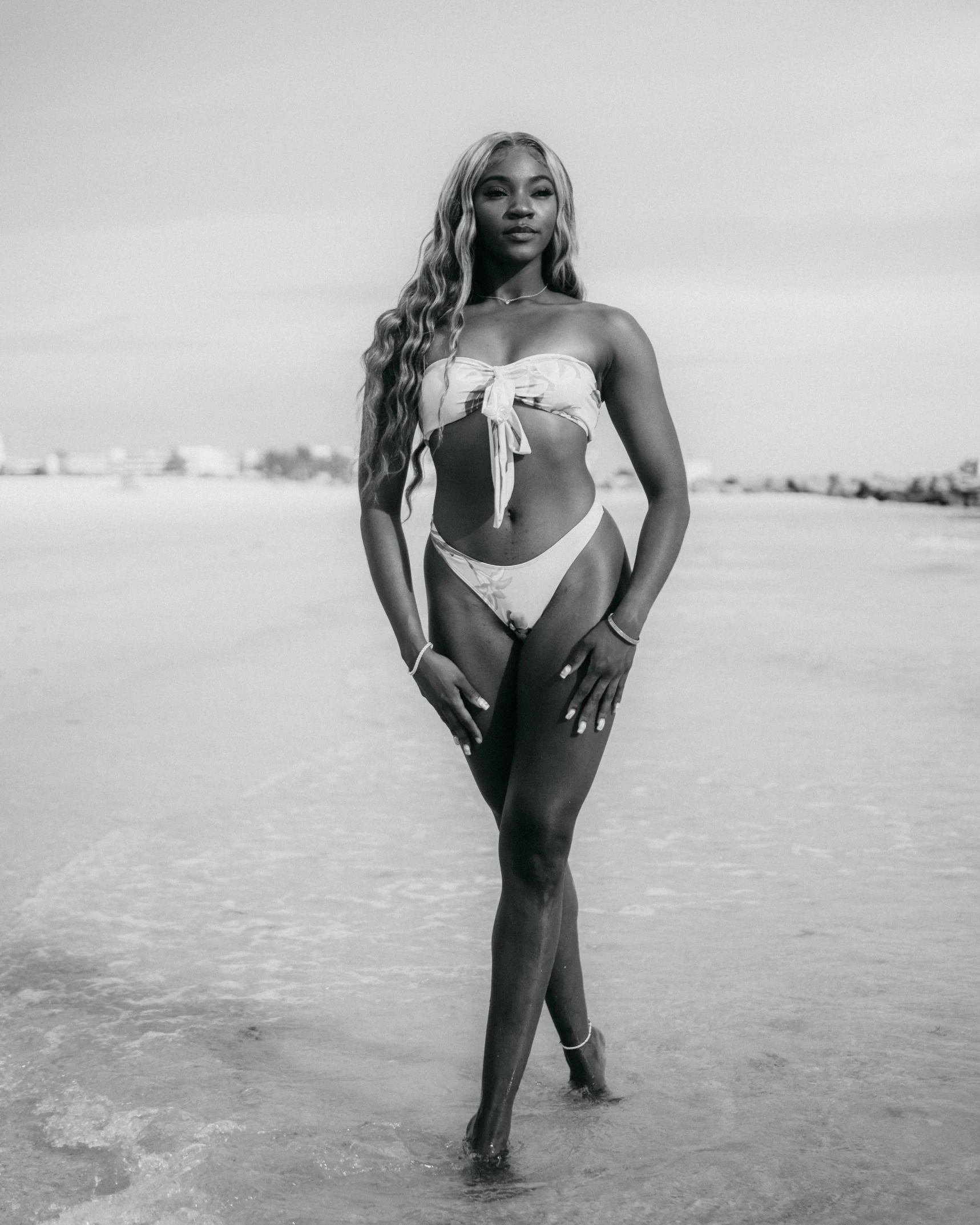 a woman in a bathing suit on a beach