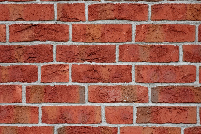 close up of a brick wall with an orange substance