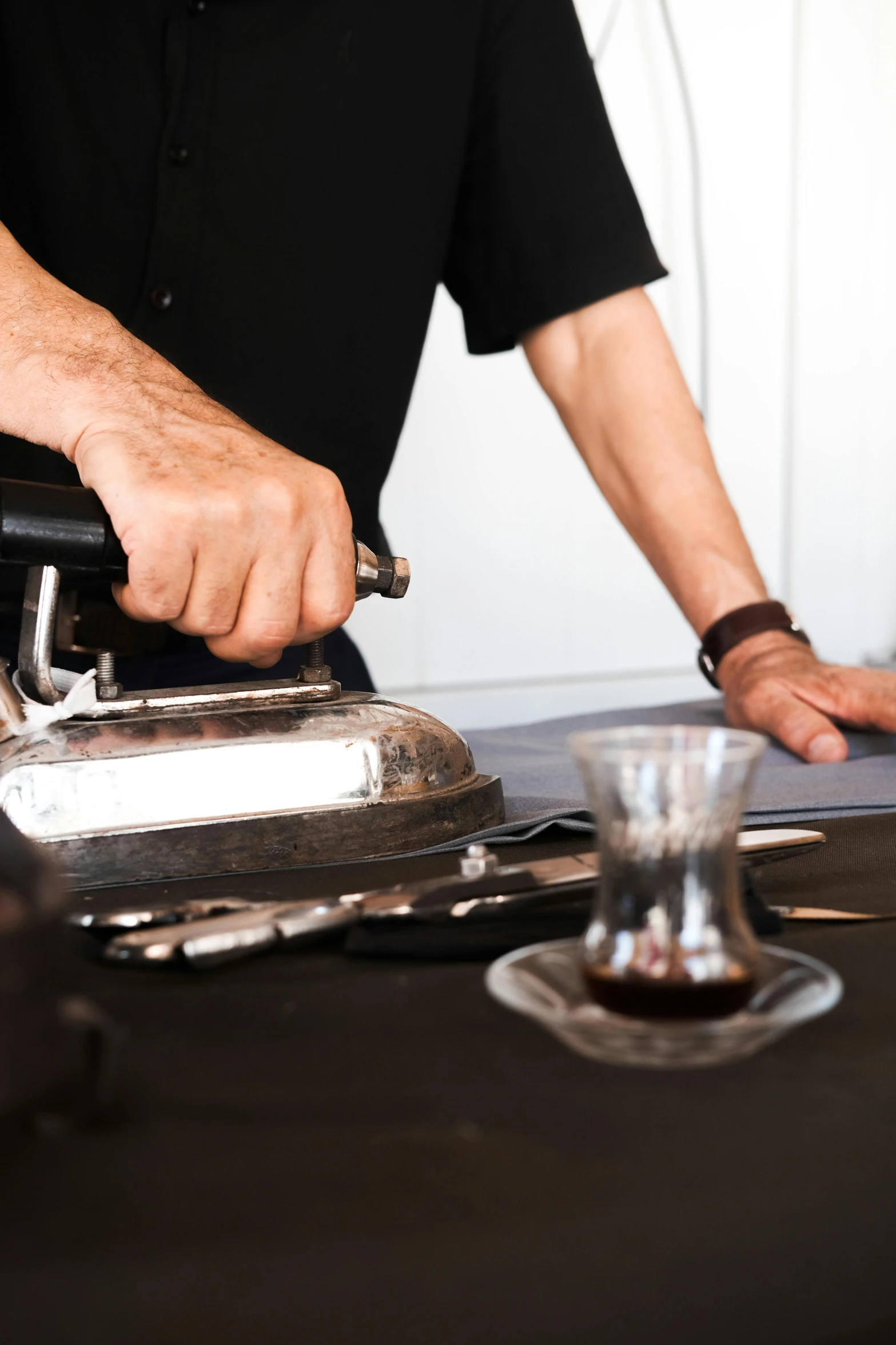 a close up of a person pouring coffee