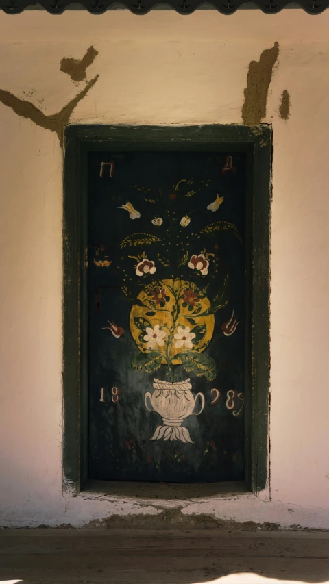 a door to a house with decorations on the front