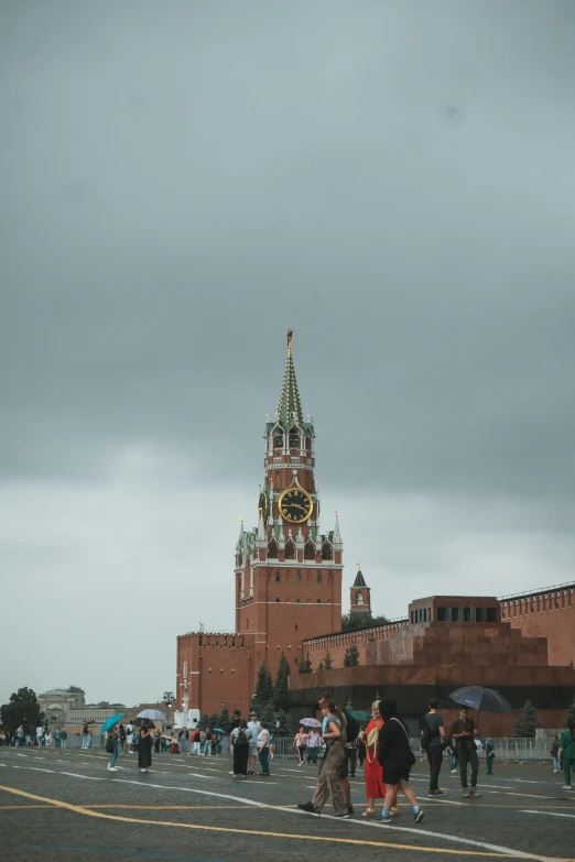 a big building with people walking around and others looking