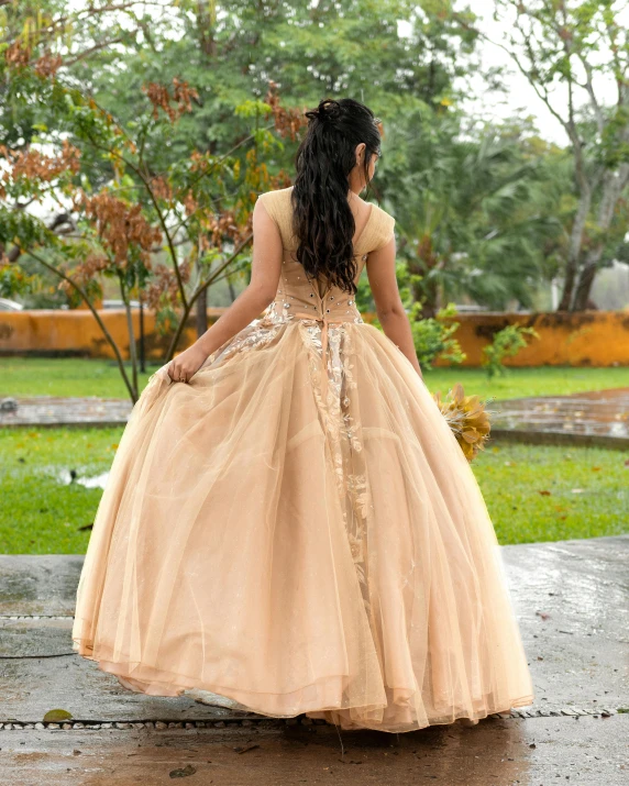 woman walking in the rain, wearing a fancy gown