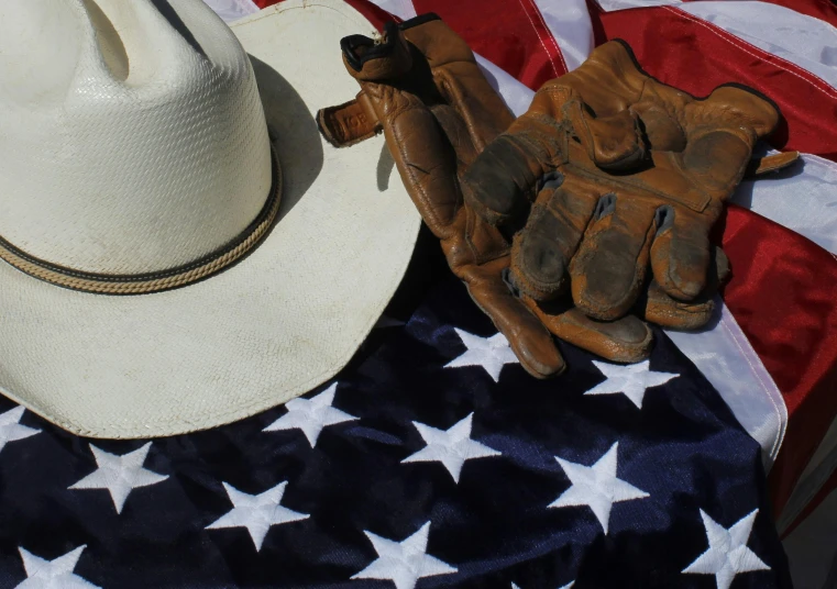 an old hat, gloves and american flag