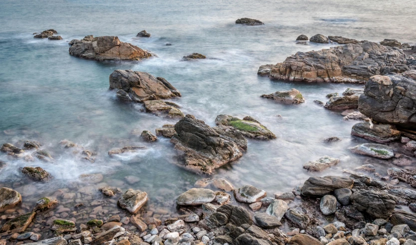 a beautiful ocean scene with rock formations and water