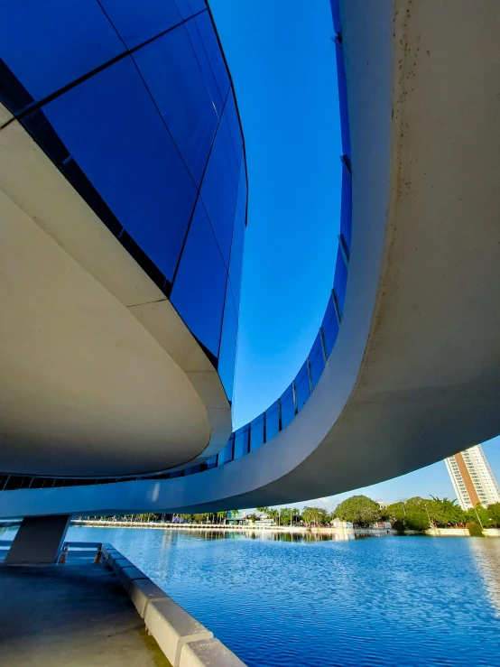 an exterior view of a large building that has a curved roof