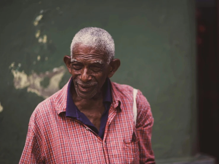 a man stands and smiles at the camera