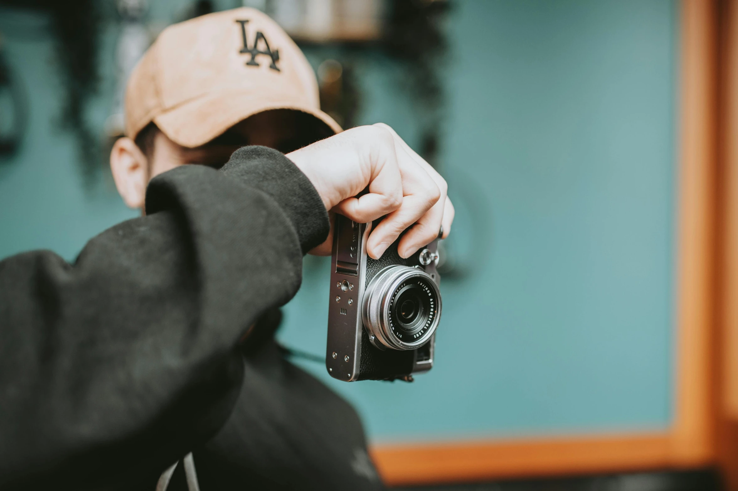 a man takes a picture in his digital camera