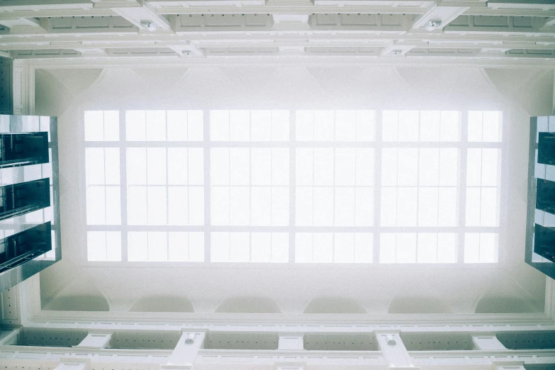 an empty building with the sun streaming through