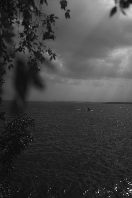 a boat floating in the middle of a large body of water