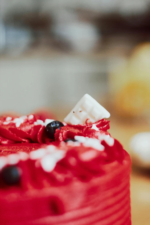 the red cake has white and blue frosting on top