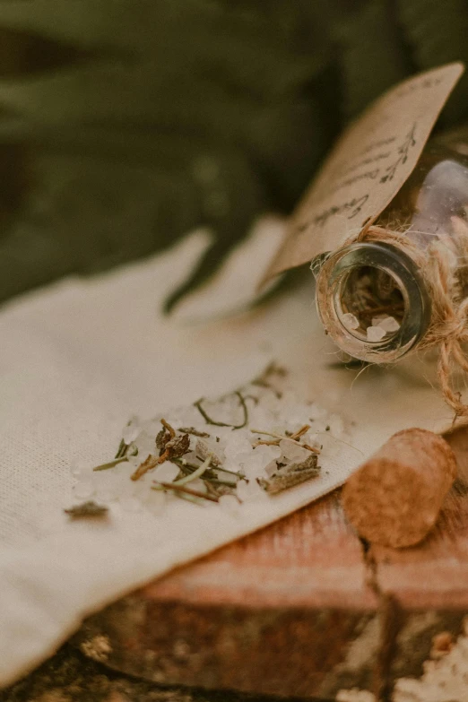 a broken cigarette bottle laying on top of a piece of cloth