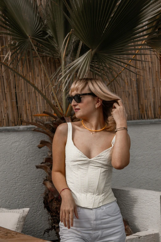 a woman is standing outside talking on a phone