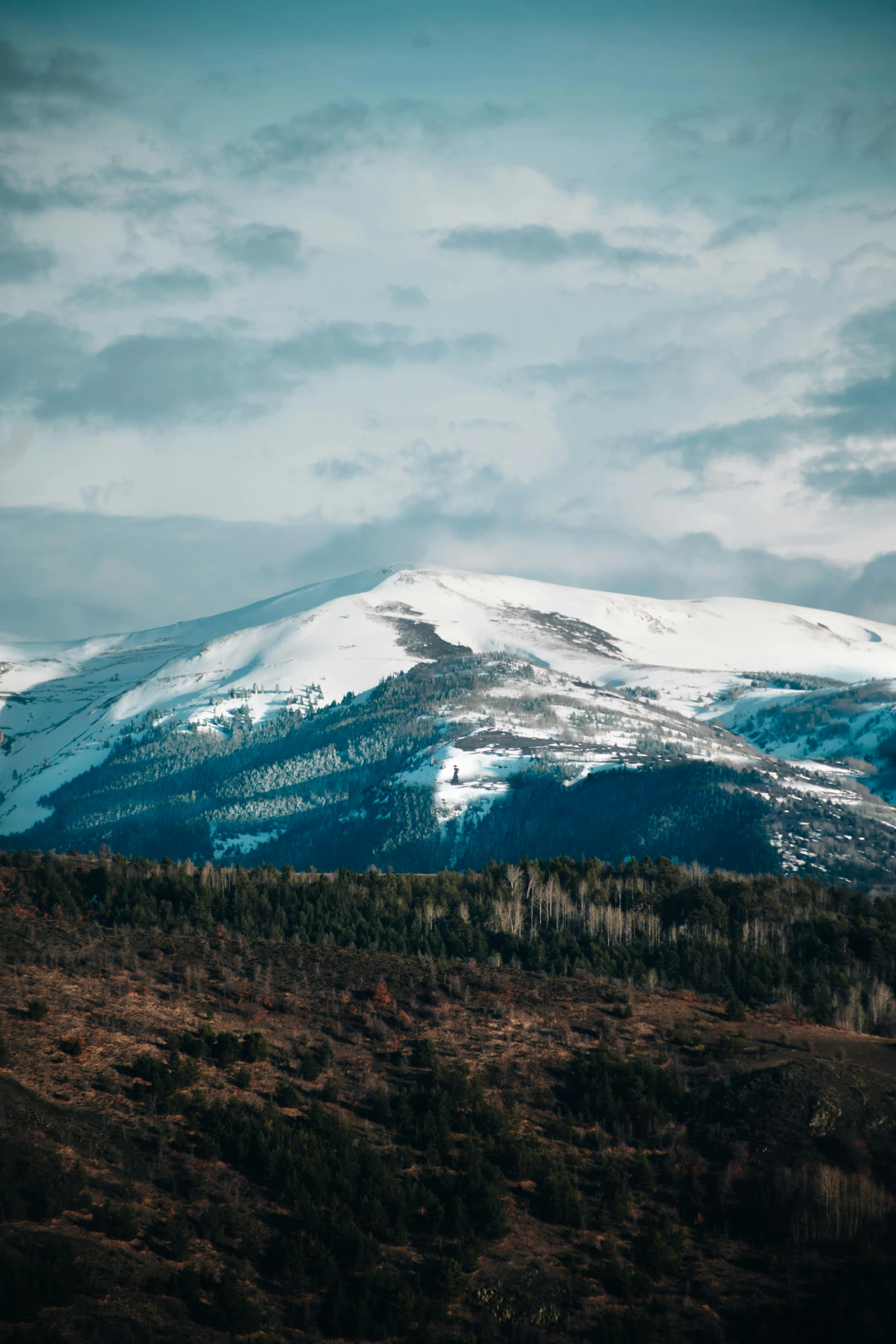 a mountain is shown with snow on it