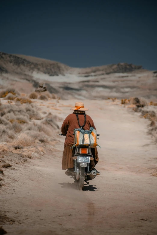 a man is riding his motorcycle in the desert