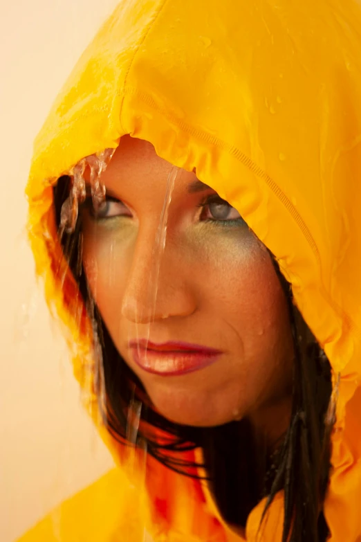 the woman's face is covered with water