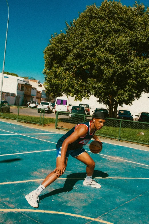 a person holding a ball while on a court