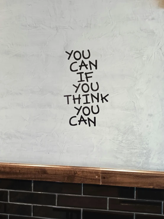 a white wall has black writing that reads, you can do if you think you can
