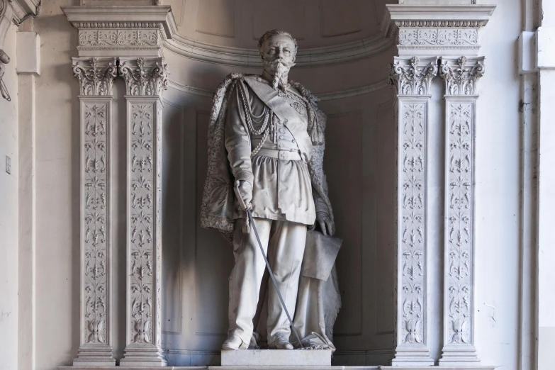 a tall statue sitting on top of a wooden floor