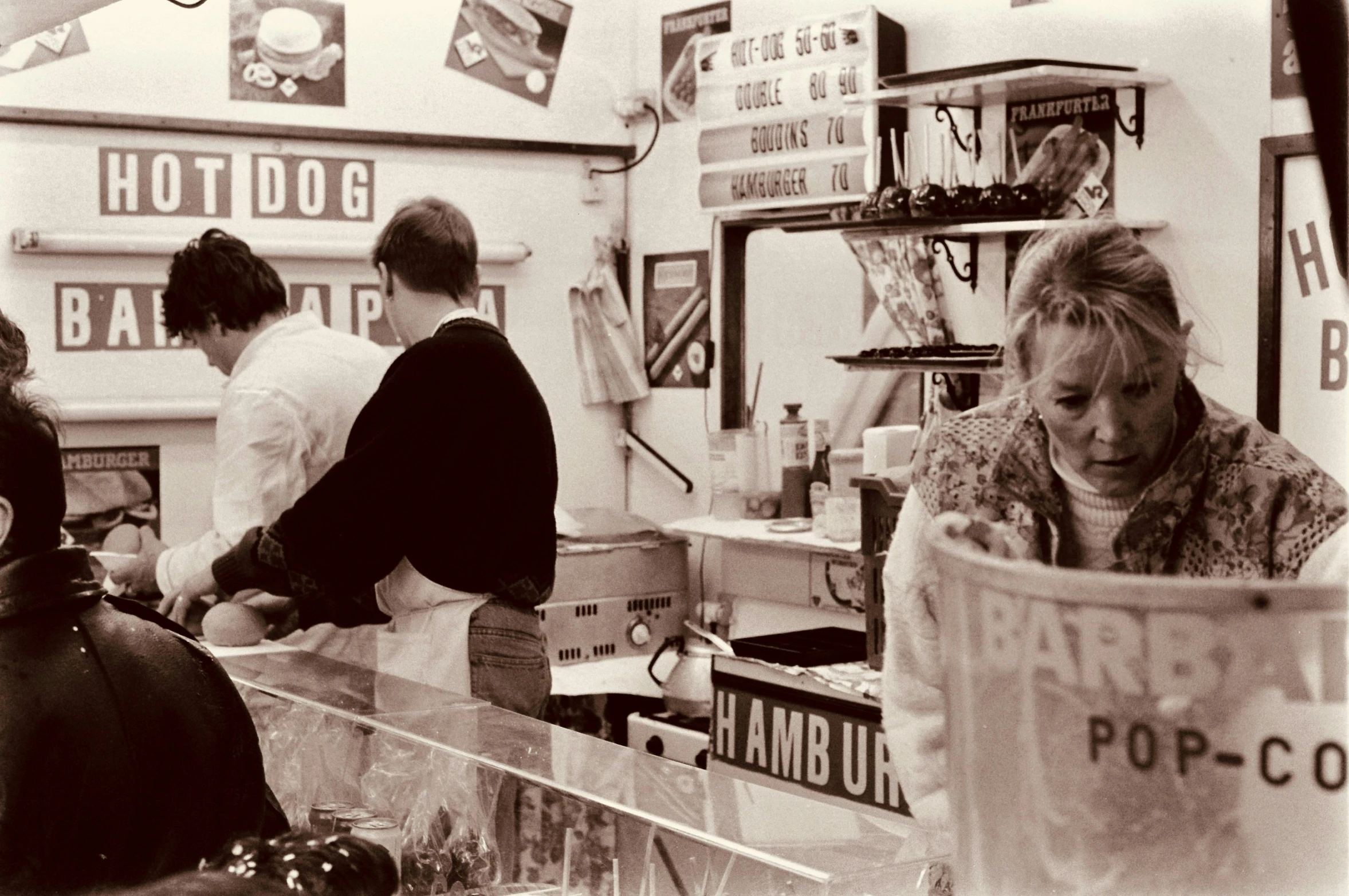 a man is working behind the counter of a restaurant